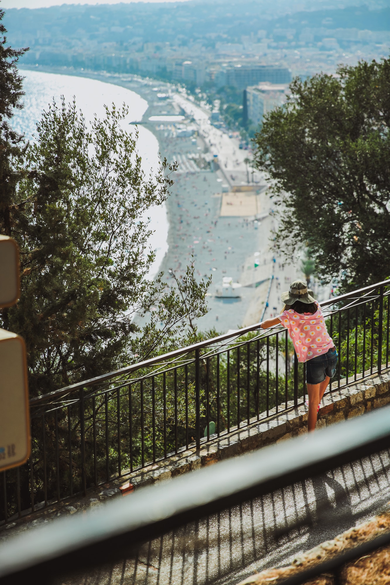 little girl looks at the panoramic view of the city of Nice in France